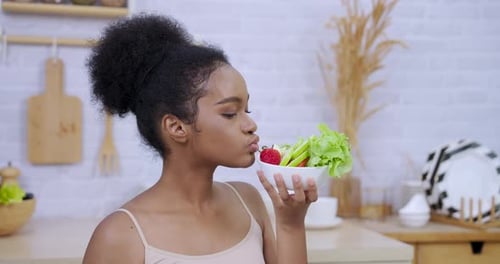 Woman Holding Salad Bowl with Fruits and Vegetables