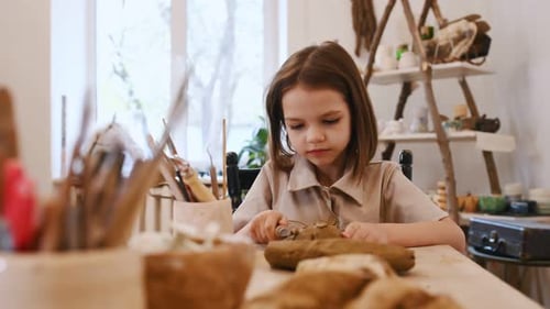 Girl Sculpting Clay Art in Studio