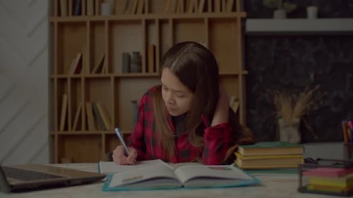 Frustrated Cute Latin Teenager Girl Having Problems with Educational Material