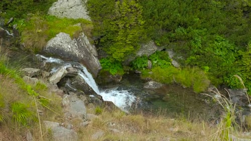 Water Cascading Down Rocks in Mountain Stream