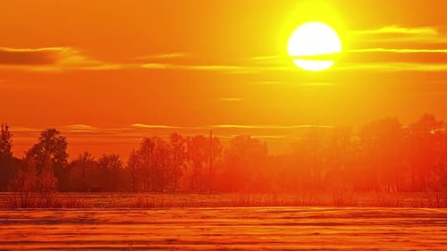 Winter Landscape at Sunrise with Golden Light