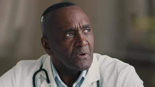 Concerned Doctor Thinking in Hospital Close Up