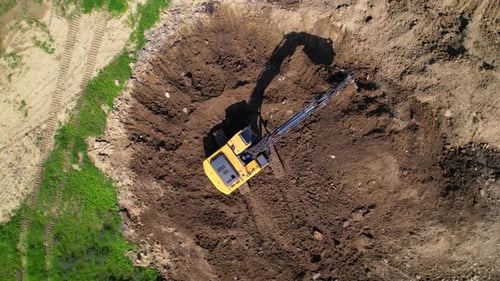 Crawler Excavator in the Process of Working Aerial View