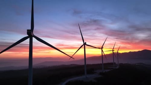 Aerial View Of Wind Turbines At Sunset