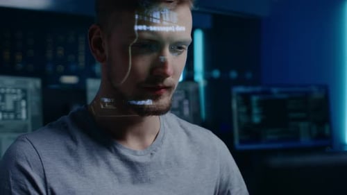 Hacker man with code projected on his face