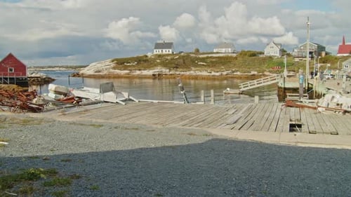 Iconic Maritime Scene Of Peggys Cove With Lighthouse And Atlantic Ocean Horizon
