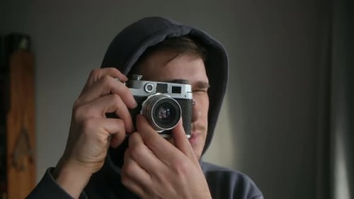 Man Holding a Classic Film Camera