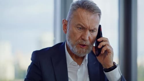 Irritated Director Talking Cellphone Sitting Office Closeup Senior Manager