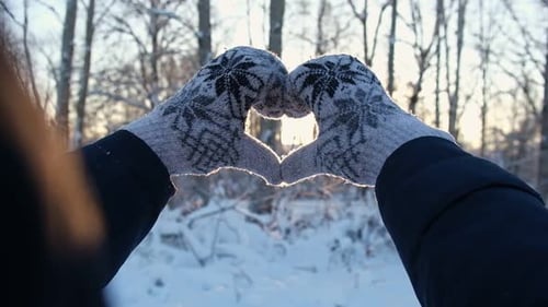 Heart Shape Made with Mittened Hands in Winter