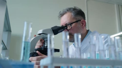 Scientist Using Microscope in a Lab Setting