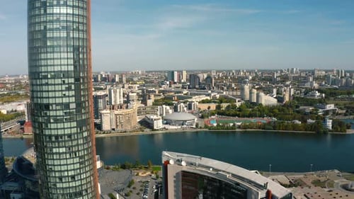 Top view of financial district with river. Stock footage. Beautiful landscape of modern city