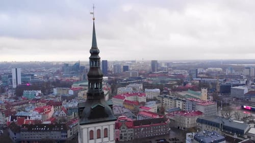 Aerial drone view over Tallinn, Estonia, showing historic old town and modern cityscape.