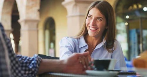 A young carefree romantic happy couple in love is enjoying their time while having breakfast toget