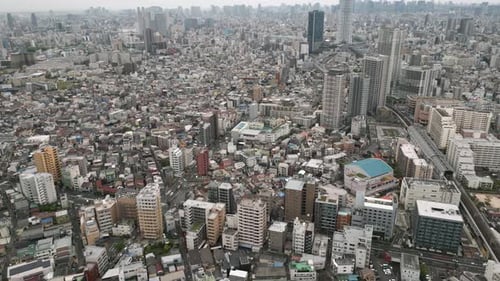Aerial Scenic Urban Drone Footage of a neighborhood, streets and buildings in the Capital City of To