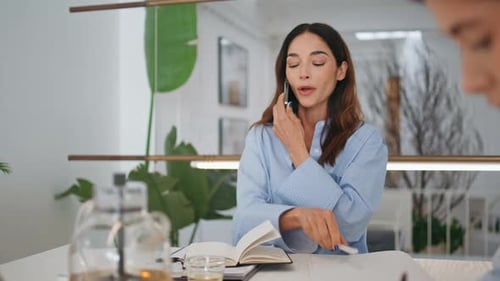 Friendly Manager Calling Client in Office Corporate Assistant Making Notes