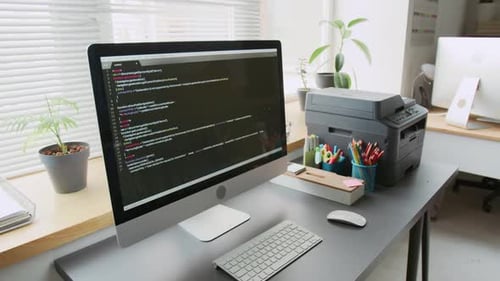 Computer on Desk in Modern Bright IT Classroom in School