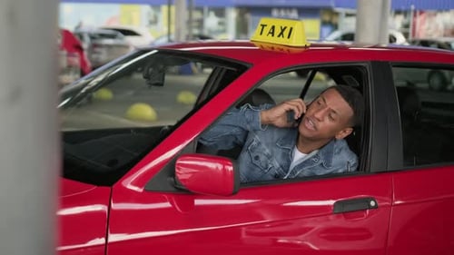 Male Taxi Driver Talking on the Mobile Phone Slow Motion