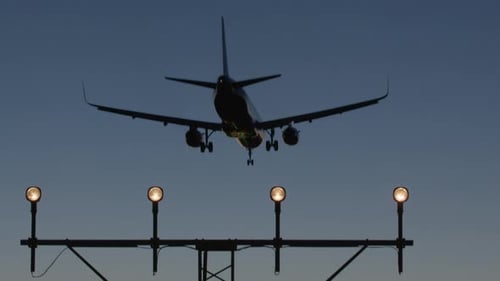 Airplane Against Dusk Sky