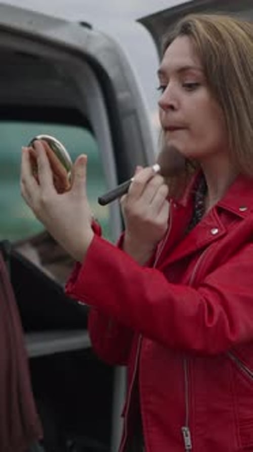 A Pretty Woman Gets Her Makeup Done for a Photo Shoot