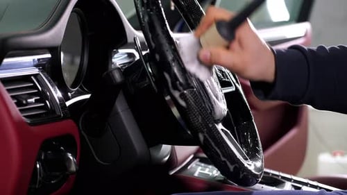 Detailing Car Steering Wheel with Foam and Brush