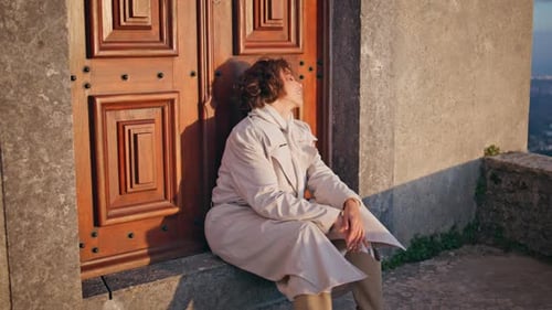 Relaxed Girl Sitting Doorway at Evening Sunlight Chic Lady Traveler Weekend