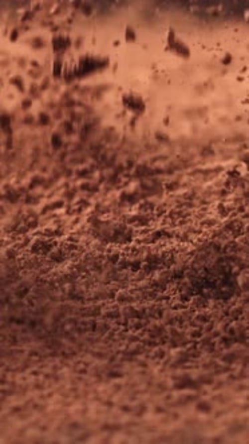 Cocoa Powder Falls on the Table Filmed on a Highspeed Camera at 1000 Fps