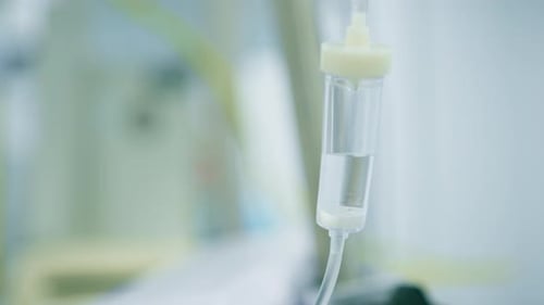 Intravenous saline bag in the operating room before the start of a surgical procedure in a clinic