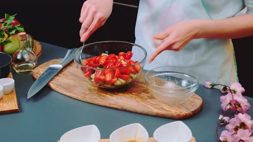Mixing Salad with Sauce on the Kitchen