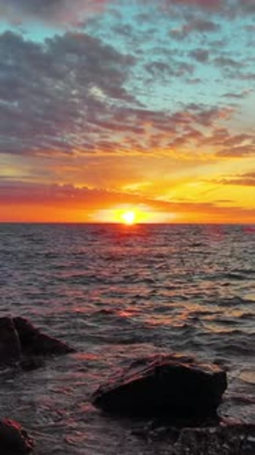 Sea and Rocks During Beautiful Sunset