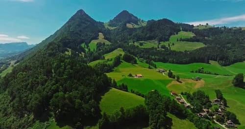 Green Alpine Valley with Swiss Traditional Houses Authentic Village in the Center of Switzerland