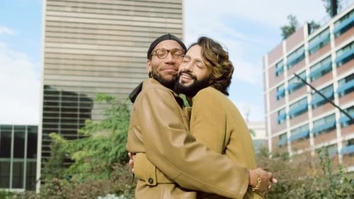Gay Couple Passionately Embracing While Talking in the Street