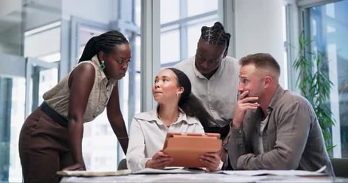 Diverse Team Collaborating with Tablet in Modern Office