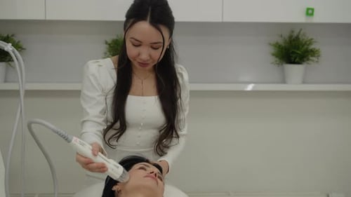 Portrait of Skilled Beautician Performing Innovative Microneedle Rf Lifting Treatment on Middleaged