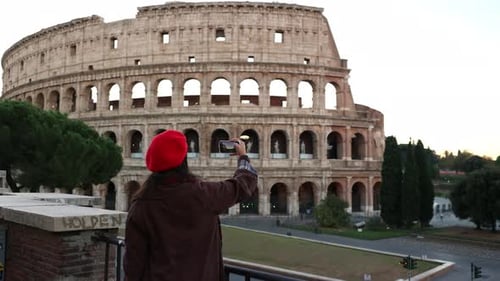 Woman Taking Photo of Colosseum on Vacation in Rome