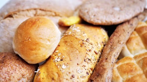 There is a Lot of Different Bread on the Table