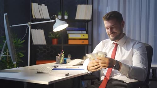 Happy businessman making money.