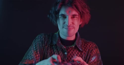 Young Adult Playing Intense Video Game