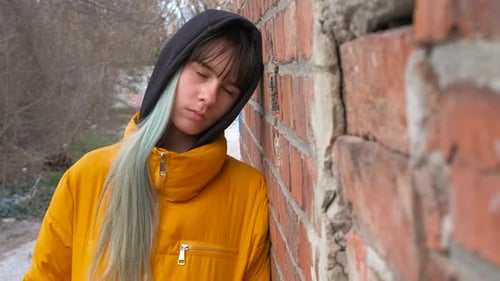 Stylish Sad Girl By Outdoor Wall