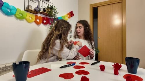Two Young Women Creating Homemade Birthday Cards