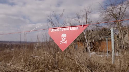 Warning Sign in a Damaged Rural Area