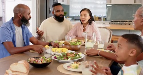Multigenerational Family Enjoying Meal at Home Together