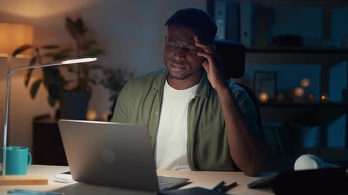 Afro Man Gesturing From Irritation While Looking on Laptop