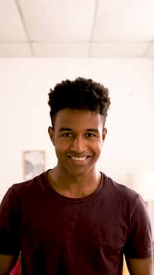 Young Adult Smiling in an Indoor Setting