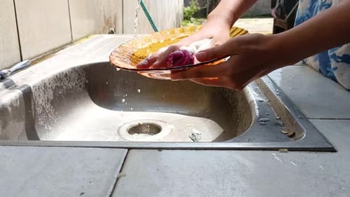 Housewife Wash Dishes At Home 4k