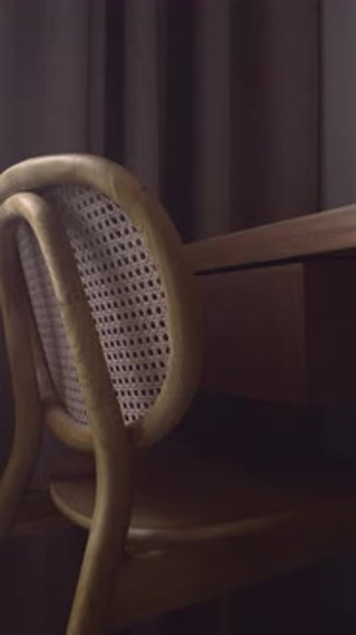Cane Back Chair Close Up In Moody Villa Study