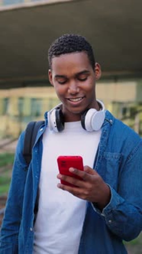 Young Adult Using Smartphone Outdoors