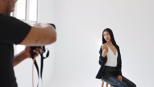 Glamorous Model Posing in Bright Fashion Studio