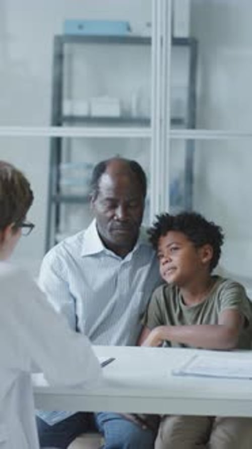 Grandfather and Child at Doctor's Office