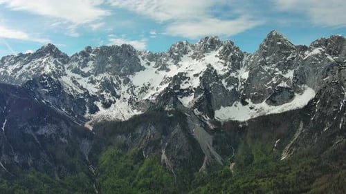 Green pasture and peaks of Apls mountain