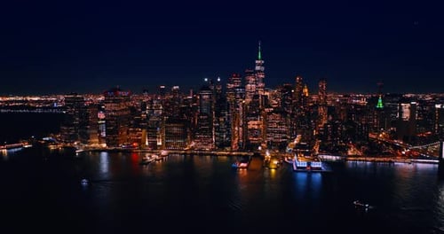 Fantastic Manhattan with dazzling illumination. Drone approaching the scenery of New York